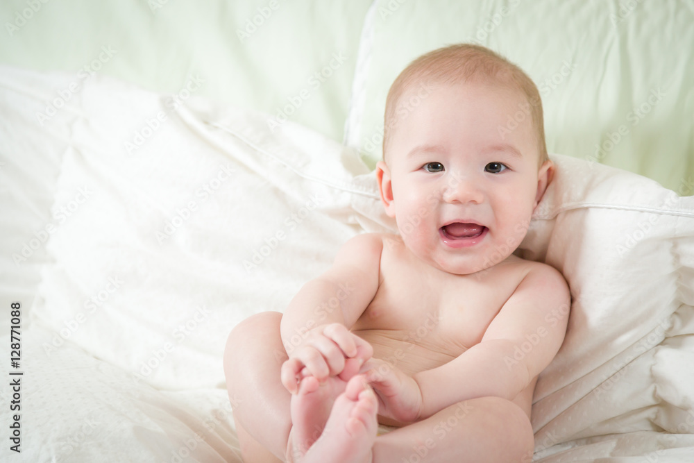 Young Mixed Race Chinese and Caucasian Baby Boy Having Fun on His Blanket. Young Mixed Race Chinese and Caucasian Baby Boy Having Fun on His Blanket.