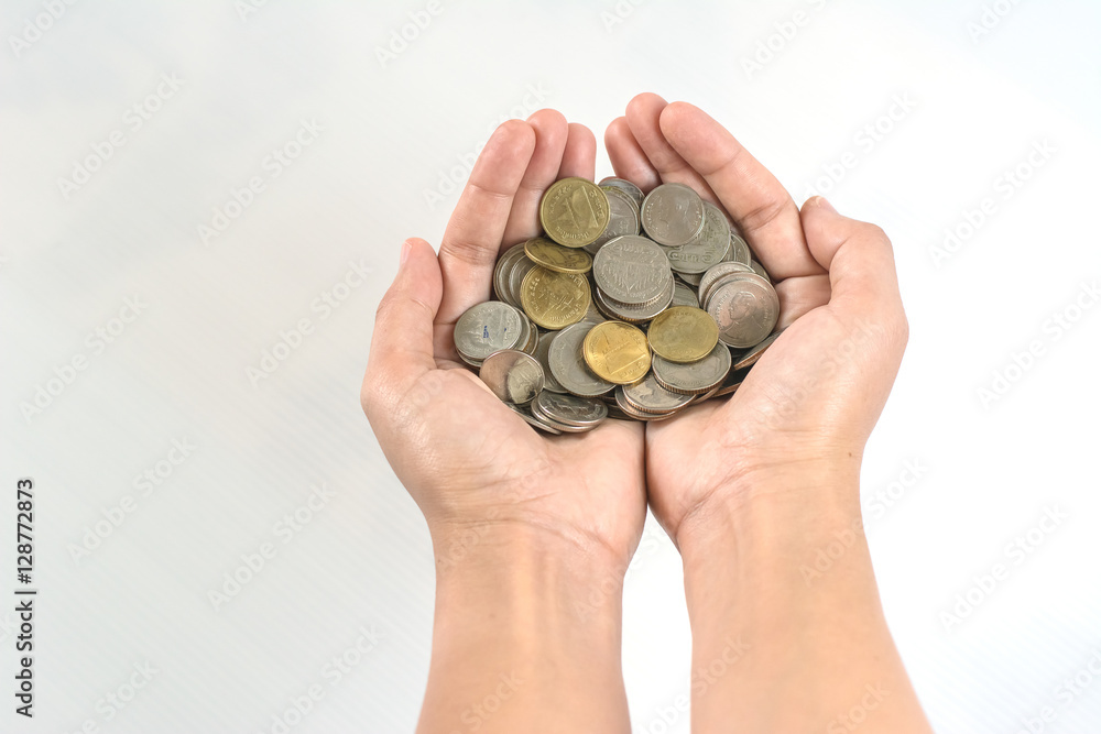 Hand stacking coins on white background Hand stacking coins on white background