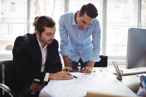 Wallpaper Mural Interior designer with male colleague working in office Torontodigital.ca