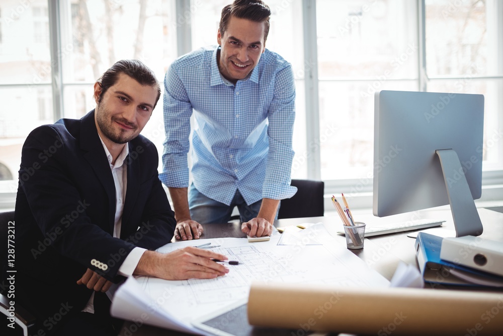 Portrait of smiling businessman with coworker Portrait of smiling businessman with coworker