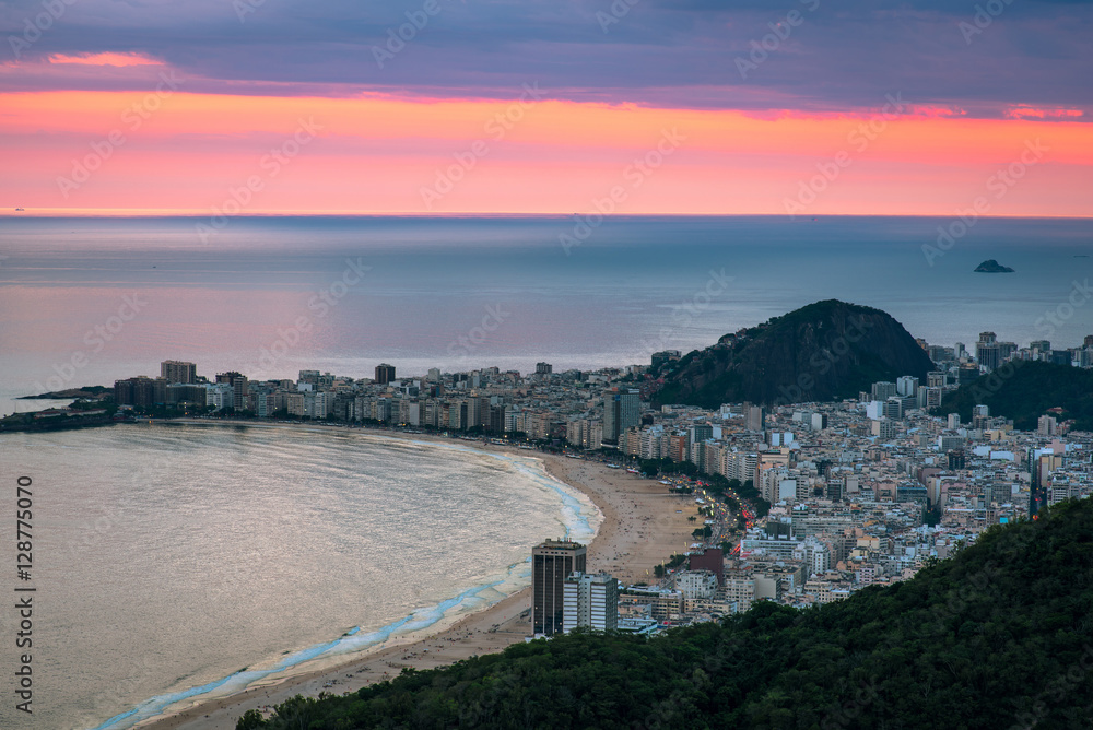 View of Copacabana beach by sunset with a pink sky, Rio de Janeiro, Brazil