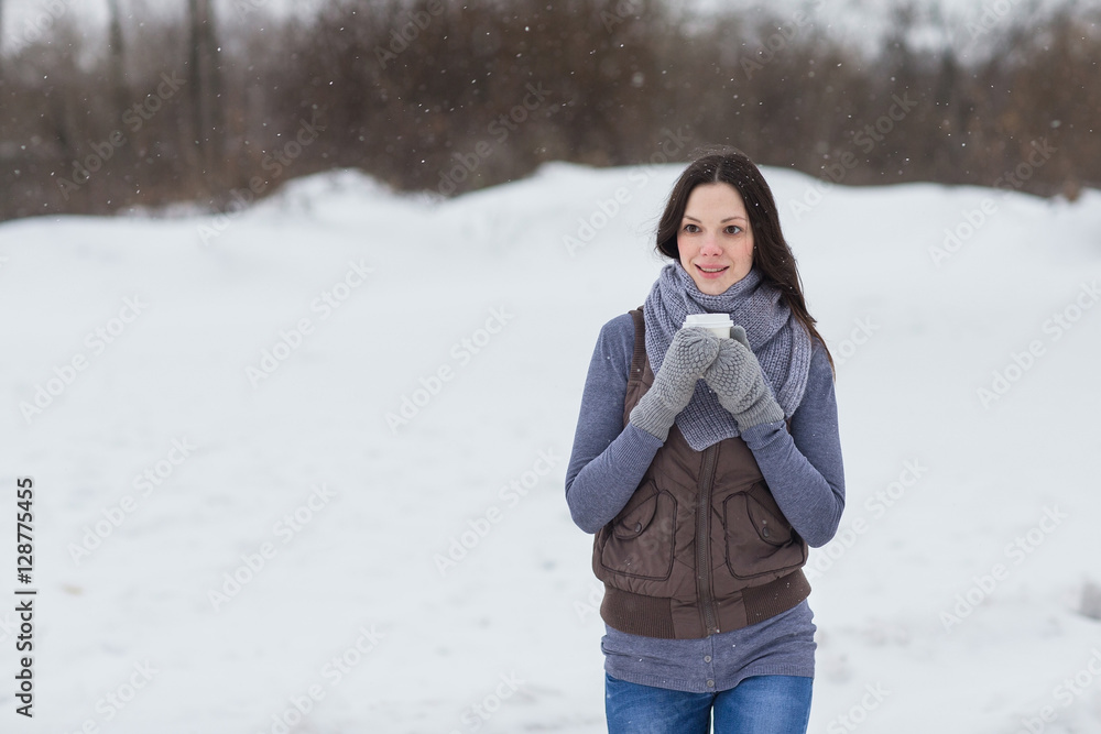 Woman holding hot drink outside Woman holding hot drink outside