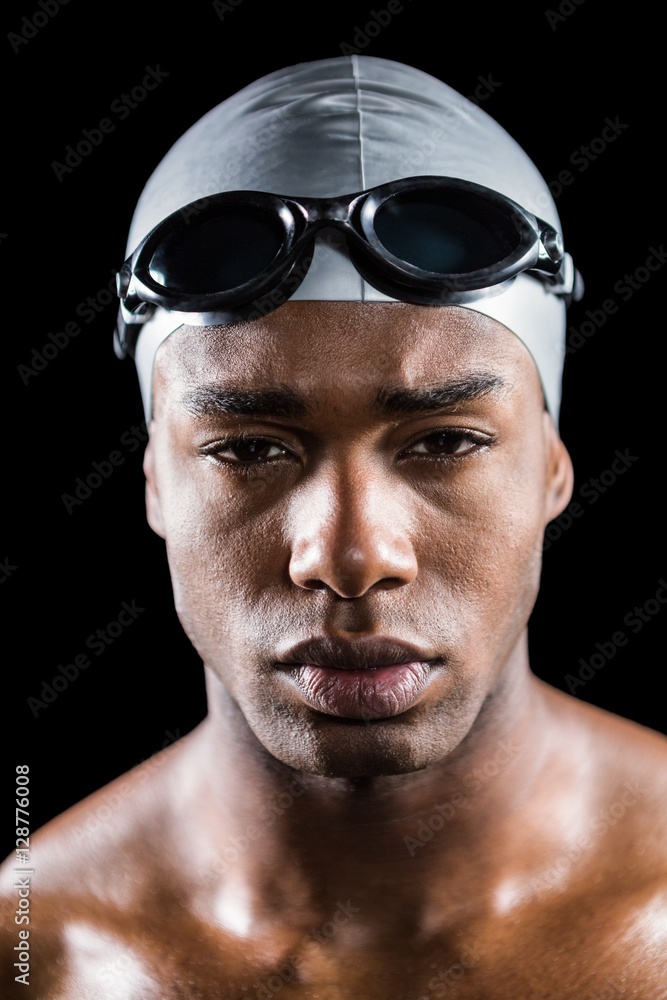 Portrait of swimmer in swimming goggles and swimming cap Portrait of swimmer in swimming goggles and swimming cap