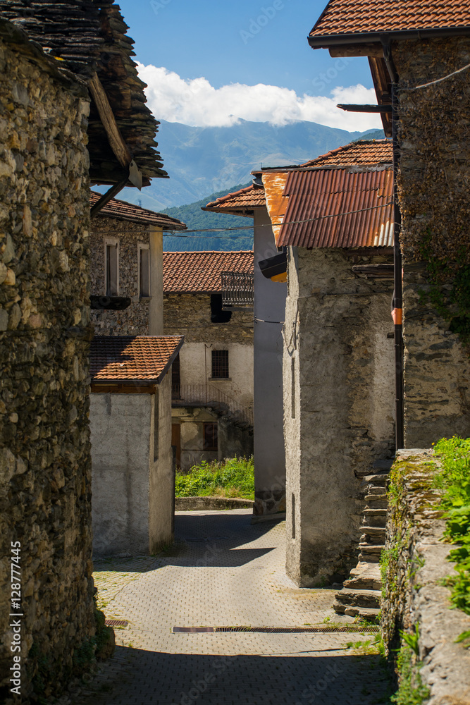 Old Italian village. Stone and tale roofs, mountains. Old Italian village. Stone and tale roofs, mountains.