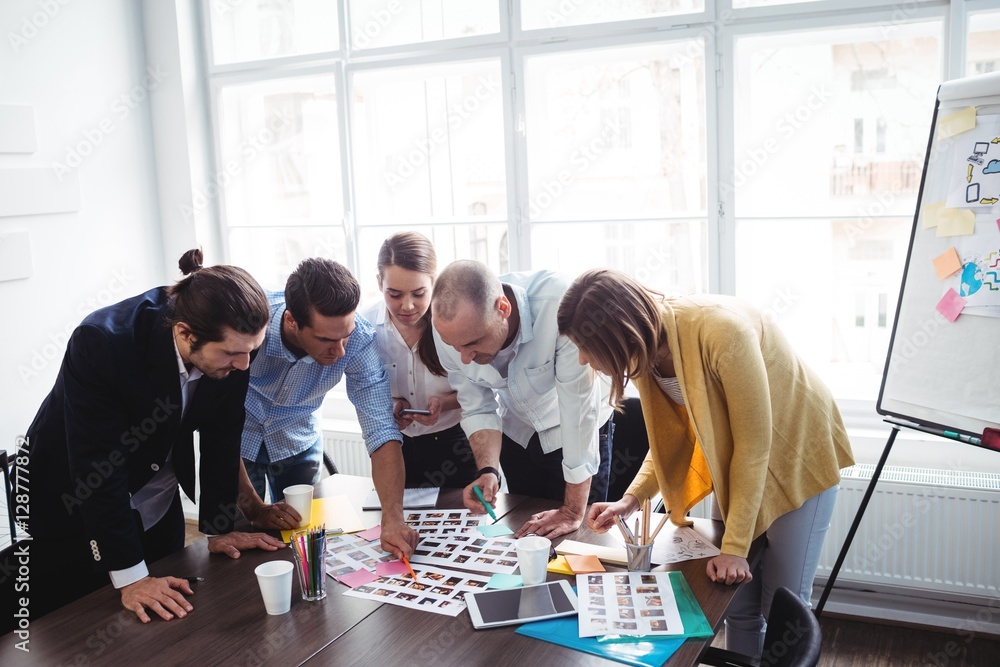 Photo editors discussing about photos Photo editors discussing about photos