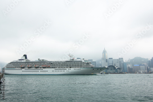 Cruiser ship trough downtown skyline landscape panorama in Hongkong island. skyscrapers horizontal composition