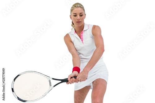 Athlete playing tennis with a racket 