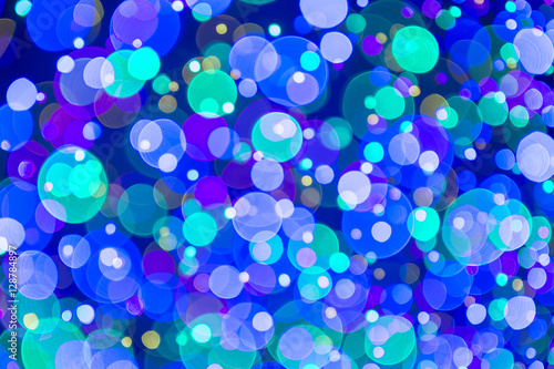 Holiday Christmas tree lights background in bright and colorful bokeh abstract © lazyllama
