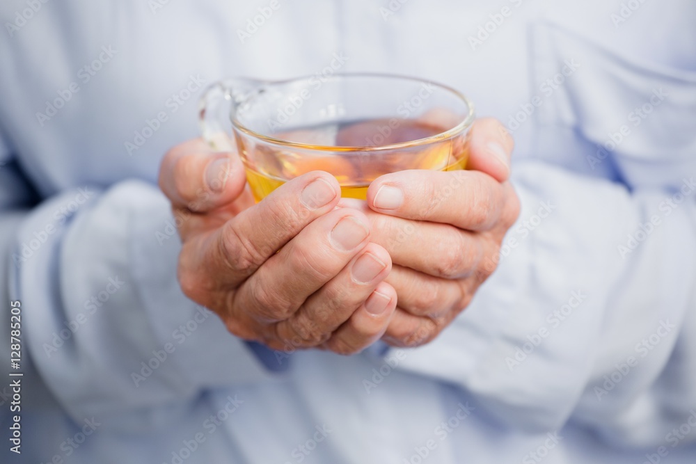 Woman holding herbal tea Woman holding herbal tea