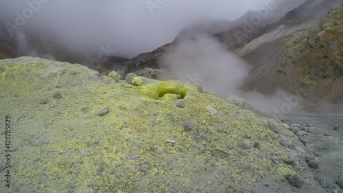 Sulfur gases emitted from a fumarole of Mutnovsky volcano. Kamchatka, Russia.