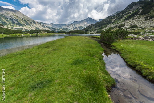 Amazing Landscape of Banderishki Chukar Peak and reflection in Muratovo lake, Pirin Mountain, Bulgaria