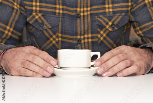 Young as he takes cup of coffee