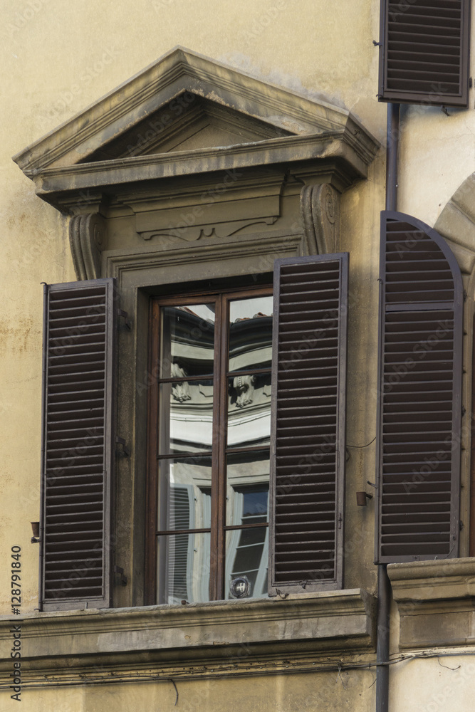 Close up of a detailed window and shudders, Italy