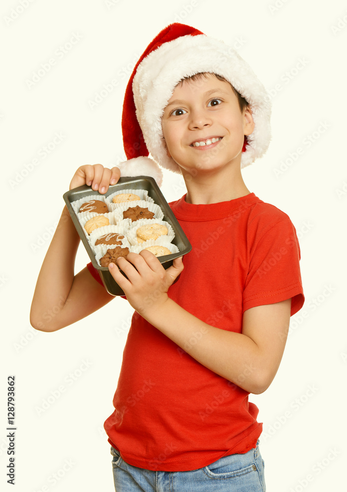 boy with cookies for santa, winter holiday christmas concept, yellow toned boy with cookies for santa, winter holiday christmas concept, yellow toned