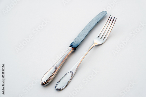 knife and fork isolated on white - beautiful silver cutlery