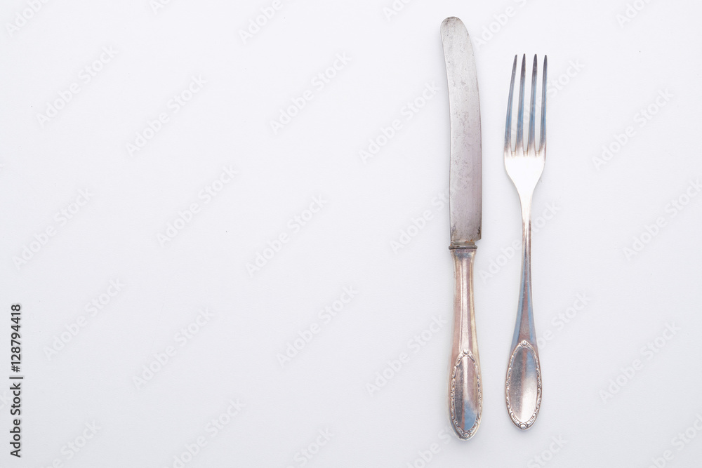 knife and fork isolated on white - beautiful silver cutlery knife and fork isolated on white - beautiful silver cutlery