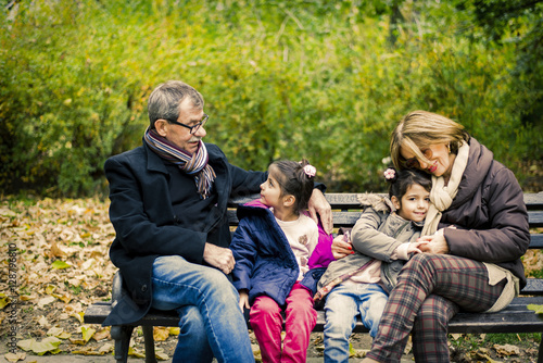 Grandparents and granddaughters in autumn park © BGStock72