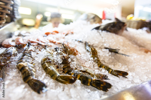 Fish and seafood lie on the ice the counter in the restaurant