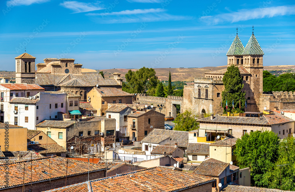 Skyline of Toledo with Santiago del Arrabal Church and Puerta de Bisagra Nueva Gate. Spain