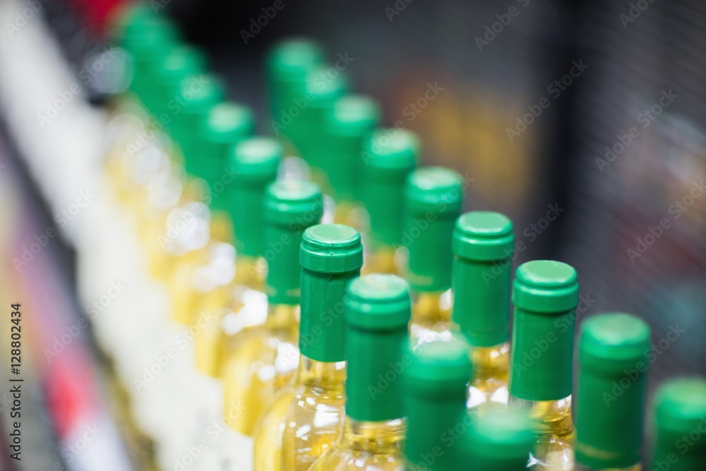 Close up of white wine bottles Close up of white wine bottles