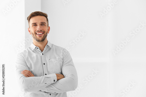 Young businessman on light ...