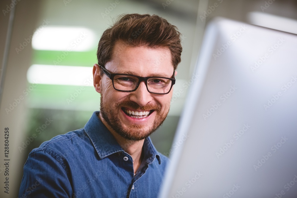 Portrait of cheerful businessman at creative office Portrait of cheerful businessman at creative office