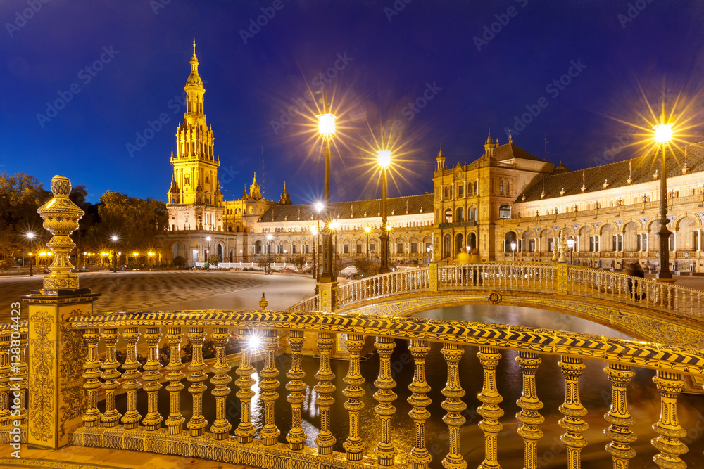 Patterned fence of the bridge on the Spain Square or Plaza de Espana in Seville during evening blue hour, Andalusia, Spain