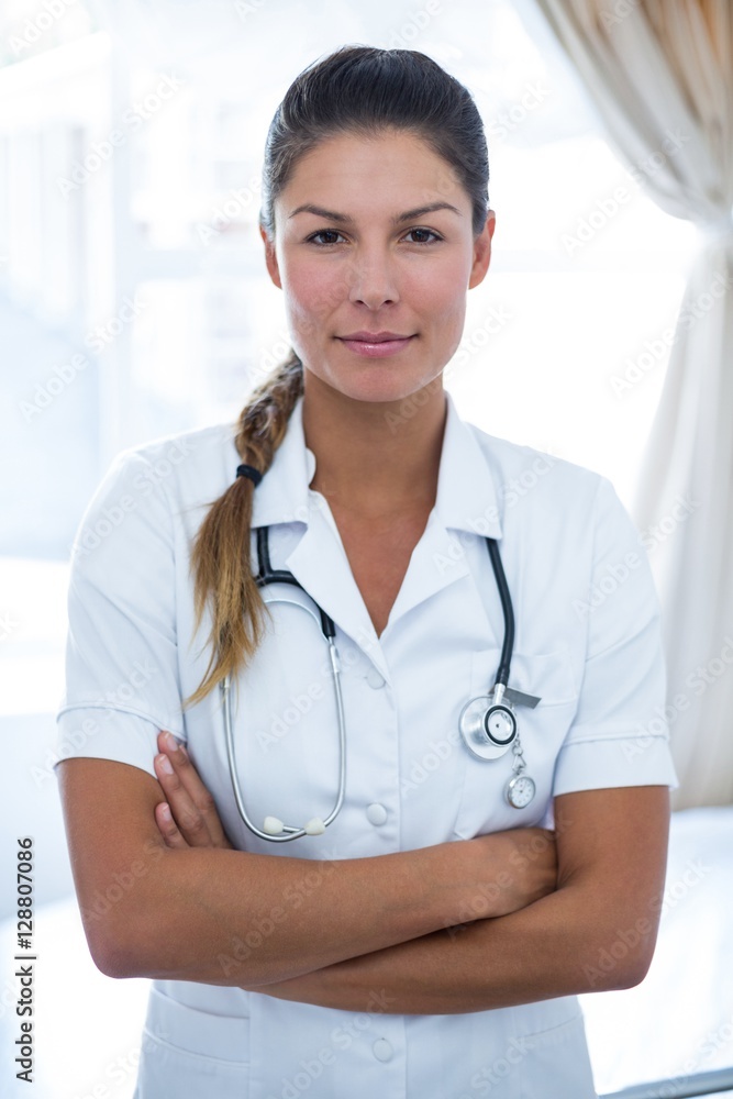 Portrait of female doctor standing with arms crossed Portrait of female doctor standing with arms crossed