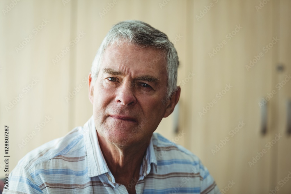 Portrait of senior man in living room Portrait of senior man in living room