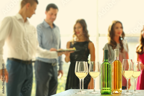 Bottles and glasses of whit...