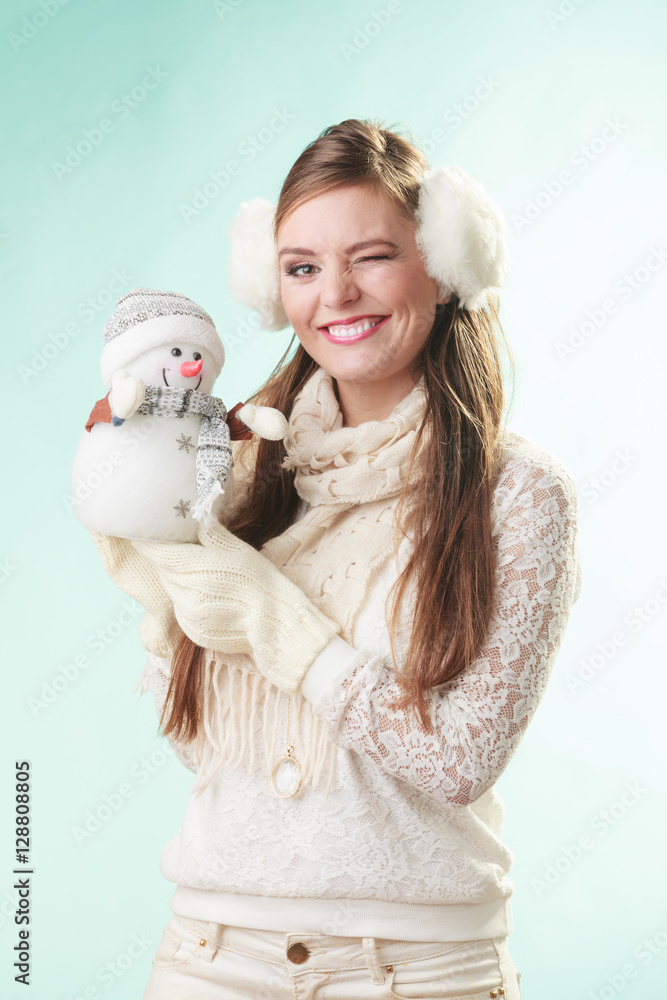 Smiling cute woman with little snowman. Winter. Smiling cute woman with little snowman. Winter.