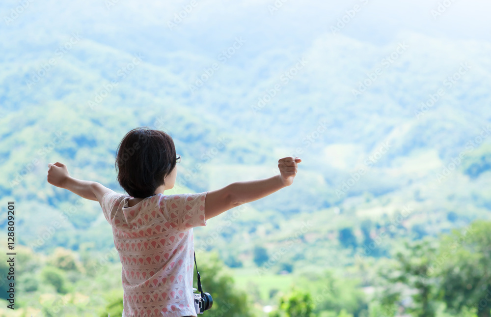 Asian woman standing at balcony and looking on the landscape. Asian woman standing at balcony and looking on the landscape.