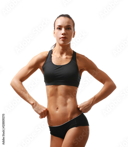 Sporty young woman posing isolated on white