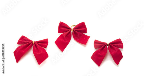 Decorative red ribbon and bow on a background of white backgroun