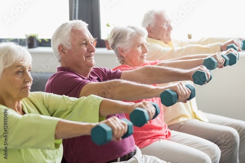 Fototapeta Naklejka Na Ścianę i Meble -  Seniors using weights