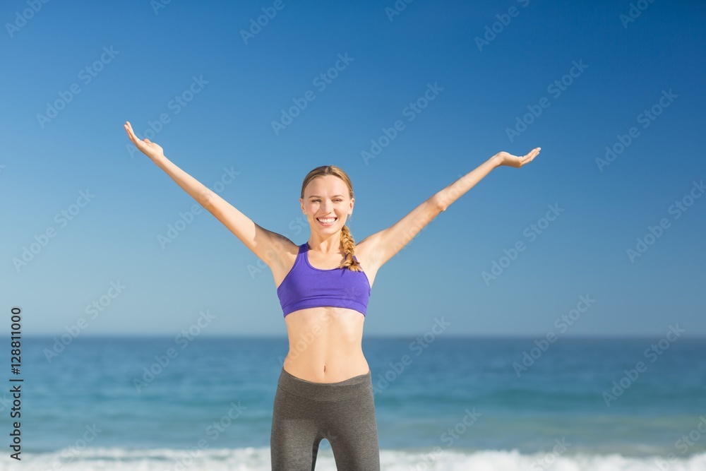 Beautiful young woman smiling while exercising Beautiful young woman smiling while exercising