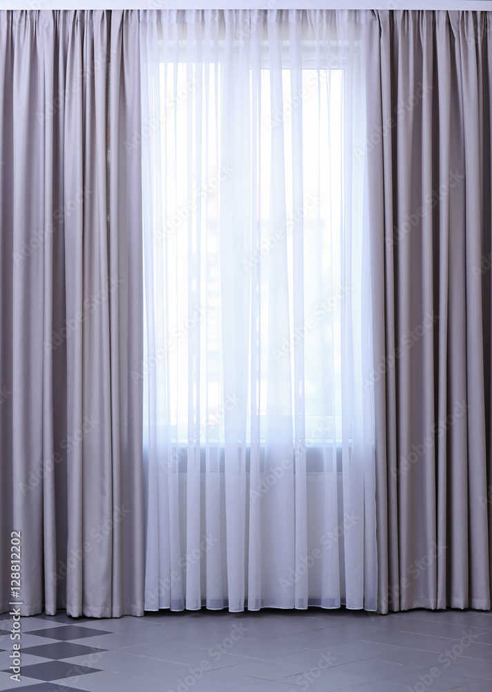 Room window with white and grey curtains Room window with white and grey curtains