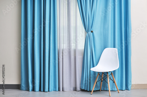 Chair and room window with ...