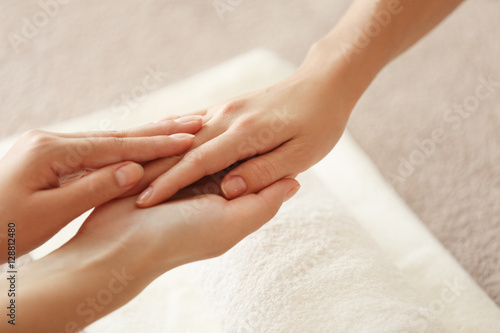 Spa concept. Specialist massaging female hand