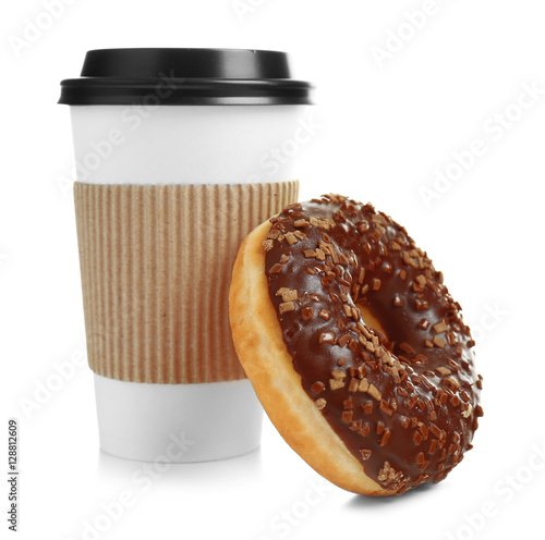 Cup of coffee with tasty donut on white background