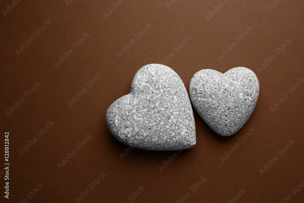 Stone hearts on grey background Stone hearts on grey background