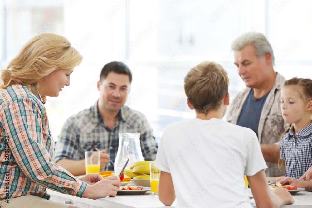 Happy large family having breakfast on kitchen Happy large family having breakfast on kitchen