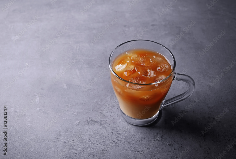 Iced coffee with milk on grey background Iced coffee with milk on grey background