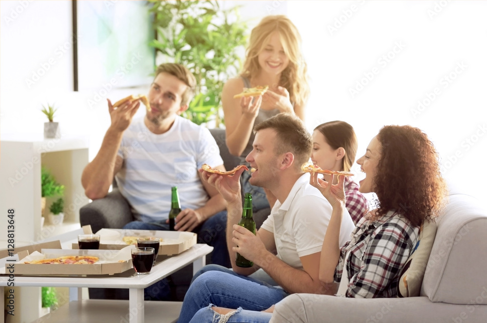 Friends eating tasty pizza at home party Friends eating tasty pizza at home party