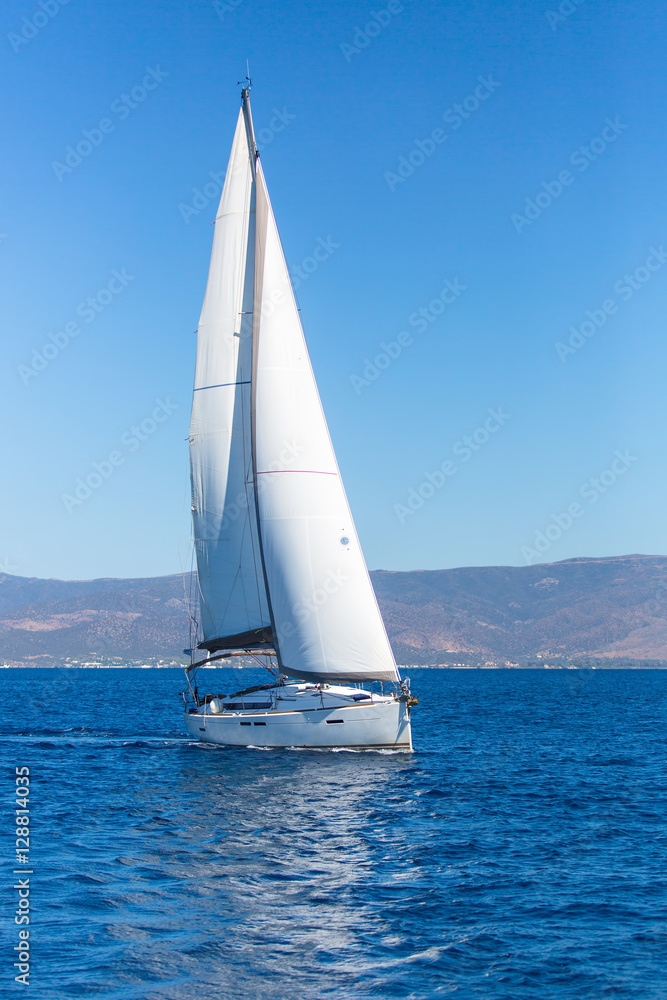 Sailing ship boats with white sails in the Sea. Luxury yachts...