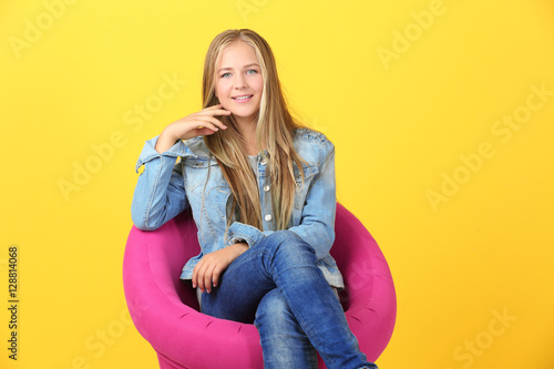 Beautiful teenager girl sit...