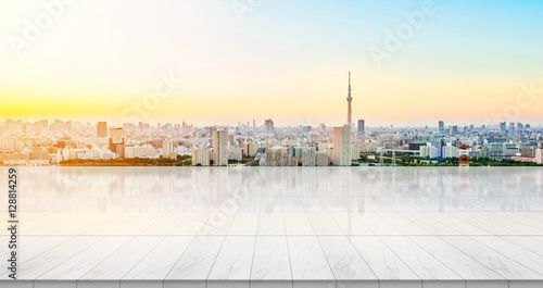 Business concept - Empty marble floor top with panoramic sky view of mountain under sunrise and morning blue bright sky for display or montage product © voyata