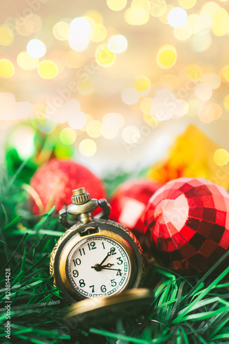 Christmas Pocket Watch with Ball and Gift Box in Blur Background