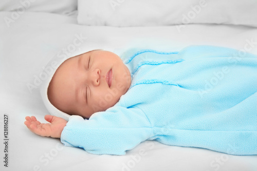Cute baby sleeping on bed
