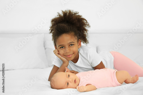 Cute baby and elder sister ...